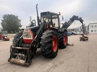 Huddig 960 C6 gårdsmaskin med skördar-aggregat